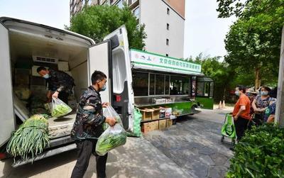统一车身标识,“点对点”配送,300吨鲜菜直送社区
